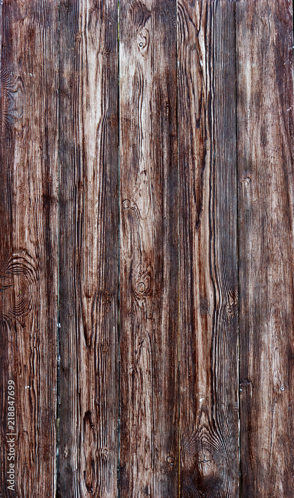 A fence of vertical dark turquoise boards. Blank background with a texture of wooden slats A fence of vertical dark turquoise boards. Blank background with a texture of wooden slats