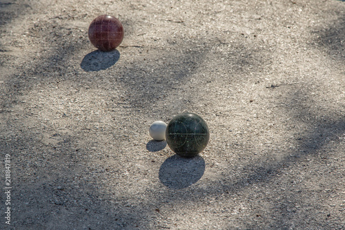 Bocce Balls on a Bocce Ball Court in Late Afternoon Sunlight