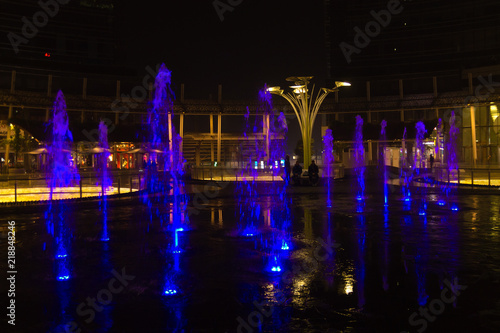 Milan  Italy  Financial district night view. Illuminated water fountains