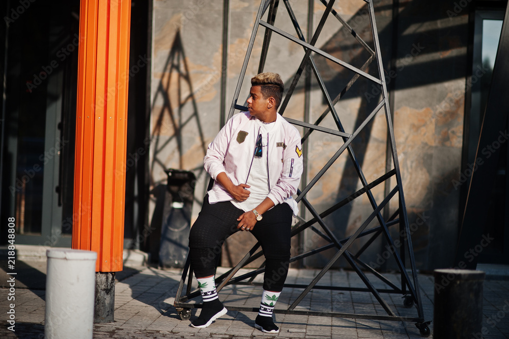 Stylish hipster arab man guy posed outdoor in street. Style rap singer. Stylish hipster arab man guy posed outdoor in street. Style rap singer.