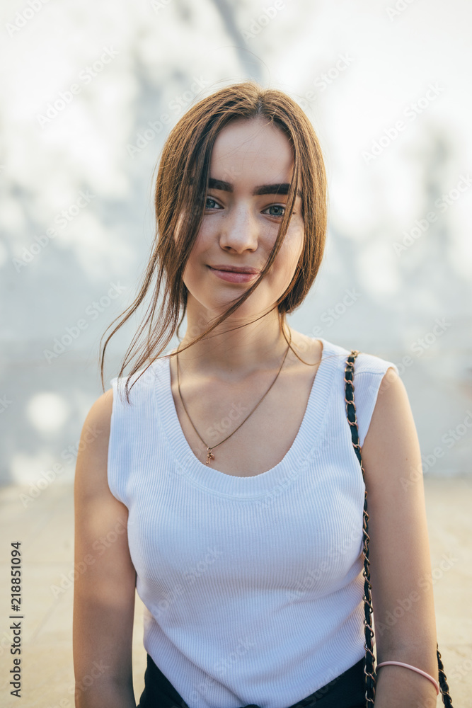 Portrait of beautiful young female on summer day