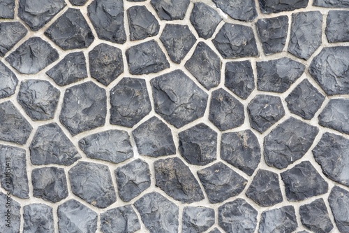 Gray mosaic stone wall background. Nice stones with a very special and individual pattern