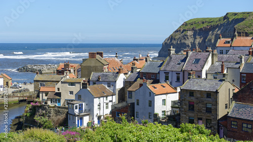  Overlook of iconic Noth Sea fishing village of Staithes in North Yorkshire, England © teesixb