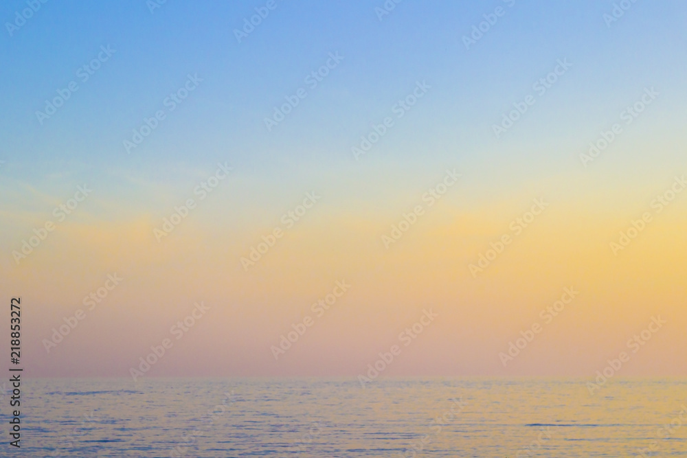 Fototapeta premium The sea at sunset, the sky in pastel colors.