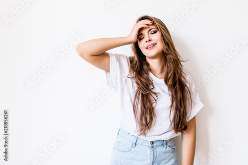 Young woman suffering of the pain over white background