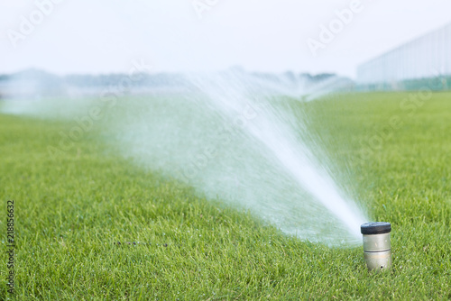Watering a football field with automatic control