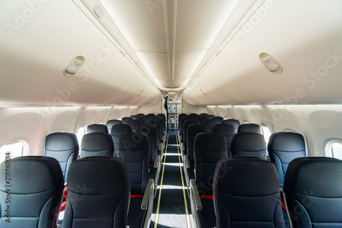 Economy class cabin in a modern civil airplane.