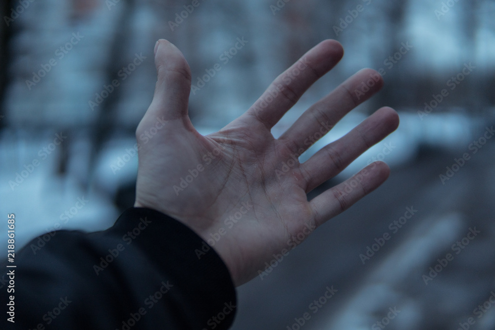 Hand in the cold.Blurred background