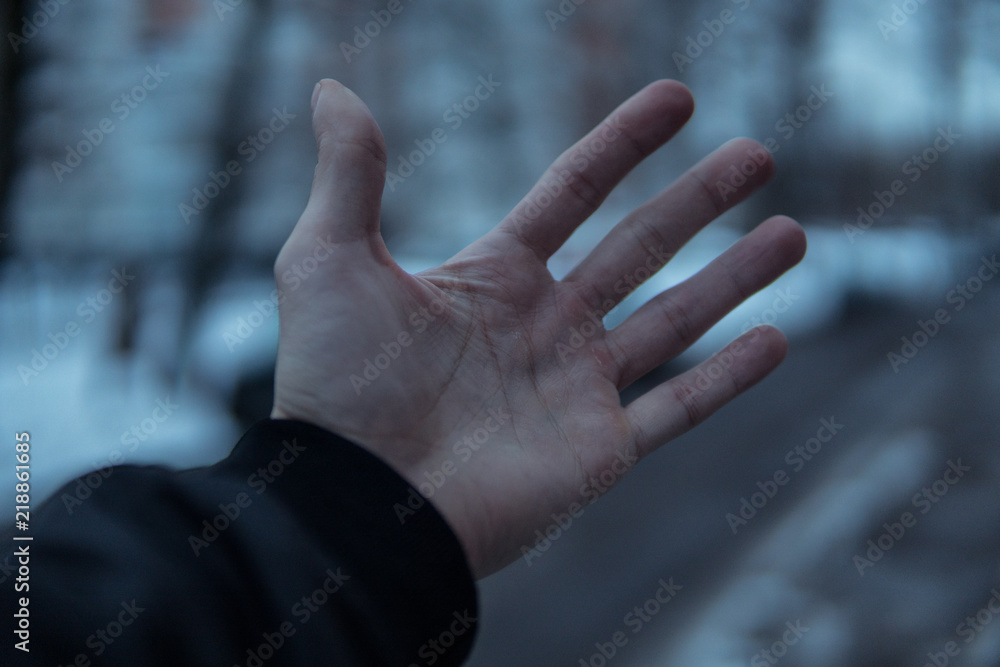 Obraz premium Hand in the cold.Blurred background