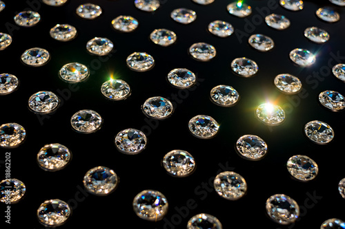 diamonds arranged in rows on a black background