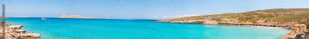 Beautiful bay with turquoise water. A popular tourist beach. Kolokitha beach. Peninsula Kalydon. Crete, Elounda,Greece.Panoramic view HD.