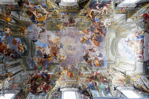 Stampa su tela Paintings and frescos on the ceiling of a catholic Church of St