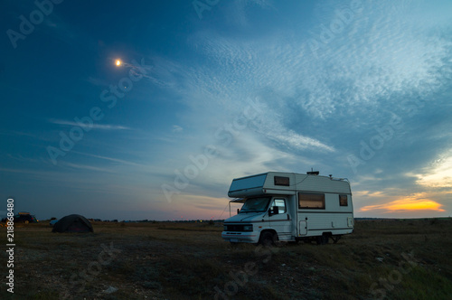 Camper van camping with blue hour sunset