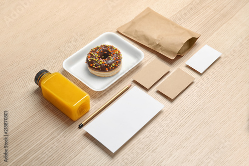 Composition with items for mock up design on wooden background. Food delivery service