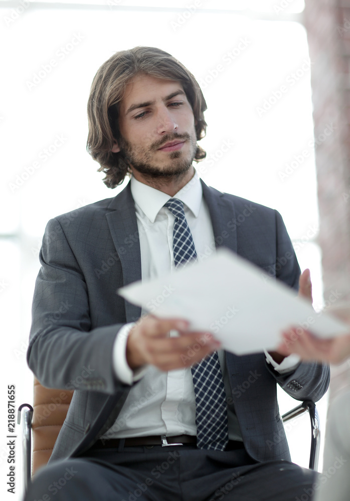 A relaxed conversation of a man and a woman in the office A relaxed conversation of a man and a woman in the office