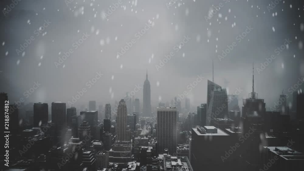 Snow falling in New York city on a cold grey day Snow falling in New York city on a cold grey day
