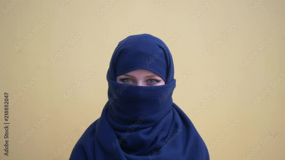 close up portrait of lovely young muslim business woman wearing hijab headscarf looking confident smiling calm professional ambitious over yellow background close up portrait of lovely young muslim business woman wearing hijab headscarf looking confident smiling calm professional ambitious over yellow background