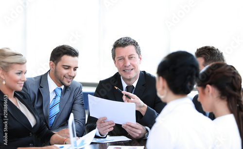 businessman and his business team discussing working papers.