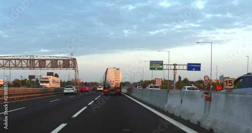 Traffic on Italian highway, road e45, towards napoli, on a sunny autumn evening sunset, in Italy photo