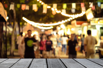 wood table top and Abstract blur food truck festival