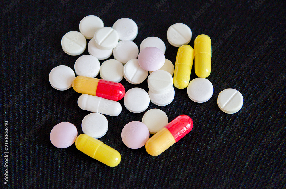 tablets are scattered on the table, dosage for the patient tablets are scattered on the table, dosage for the patient