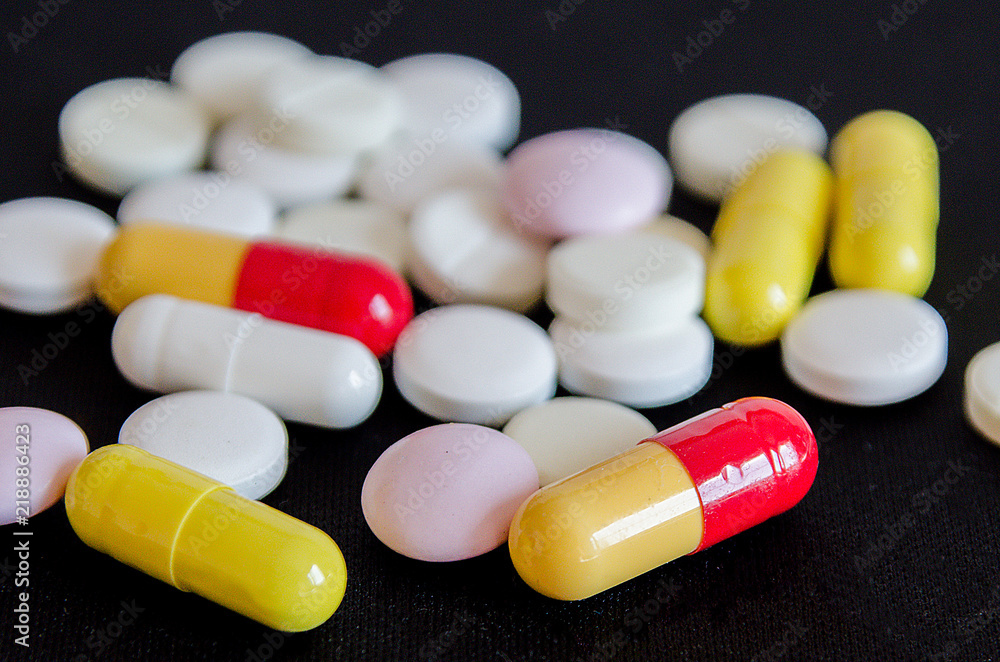 tablets are scattered on the table, dosage for the patient tablets are scattered on the table, dosage for the patient
