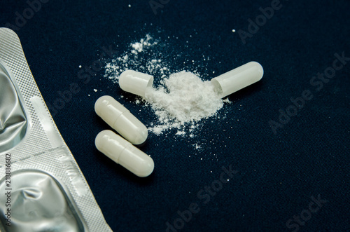 tablets are scattered on the table, dosage for the patient