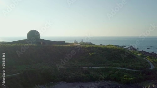 Aerial video of Fugueijiao Lighthouse,  Shimen District, New Taipei, Taiwan. photo