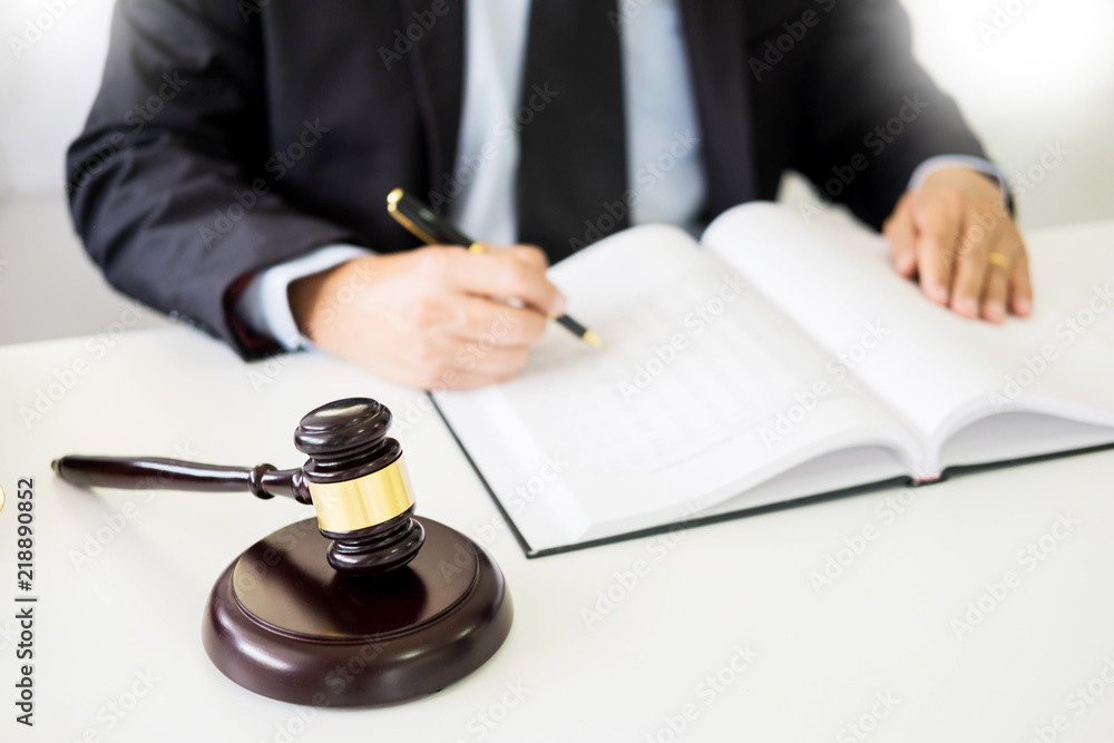 gavel and sound block of justice law and lawyer working on wooden desk background. gavel and sound block of justice law and lawyer working on wooden desk background.