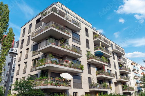 Photography Modern grey apartment building with big balconies seen in Berlin, Germany