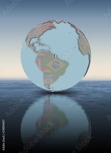 Fototapeta Naklejka Na Ścianę i Meble -  French Guiana on globe above water surface