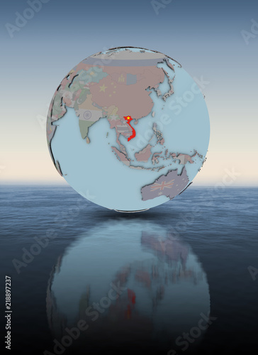 Vietnam on globe above water surface