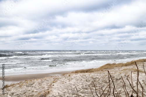 Sea and beach views from the sand dunes of the Curonian spit. Nida in Lithuania and Kaliningrad region in Russia photo