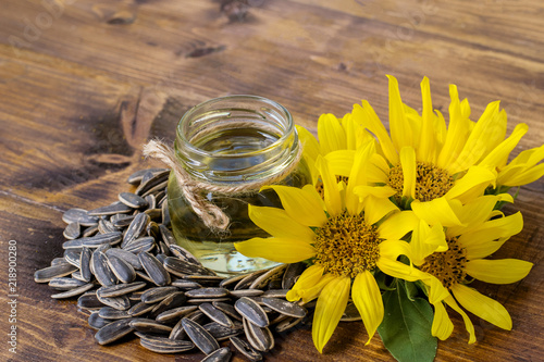 sunflower blooming with oil and seeds on wood top table with copy space