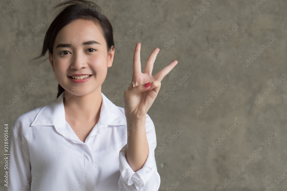 asian business woman pointing three fingers; portrait of positive happy smiling asian businesswoman pointing up three fingers, 3 points number list; asian chinese 20s young adult woman model asian business woman pointing three fingers; portrait of positive happy smiling asian businesswoman pointing up three fingers, 3 points number list; asian chinese 20s young adult woman model