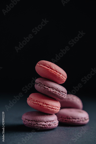 pink macarones on dark background