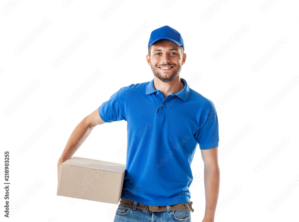 Happy young delivery man in blue uniform standing with parcel post box Happy young delivery man in blue uniform standing with parcel post box