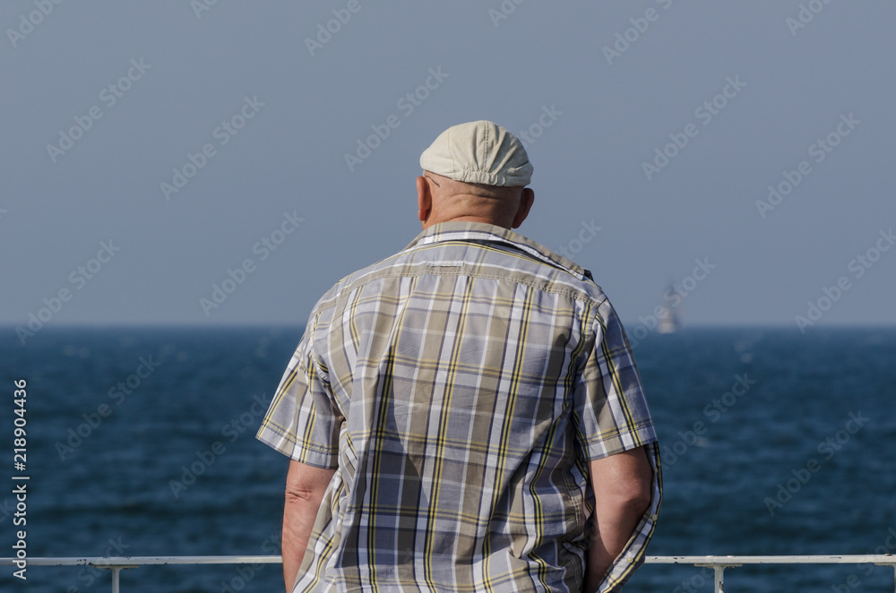 MAN ON THE BALCONY - Man against the background of the sea