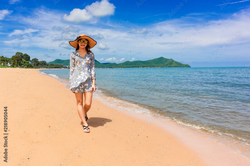 Woman traveler is enjoying the beautiful sea view on her holiday. Woman traveler is enjoying the beautiful sea view on her holiday.