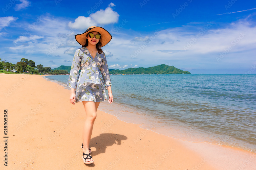 Woman traveler is enjoying the beautiful sea view on her holiday. Woman traveler is enjoying the beautiful sea view on her holiday.