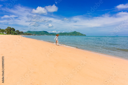 Woman traveler is enjoying the beautiful sea view on her holiday.