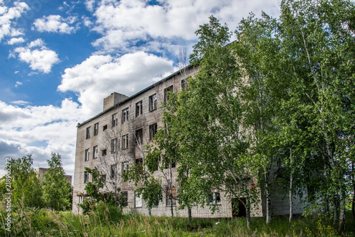 Old, destroyed, abandoned houses and buildings, broken Windows and doors photo