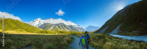 Panorama of Couple hiking on Hooker Valley Track in South island New Zealand, Mount cook national park, summertime © Lab_Photo