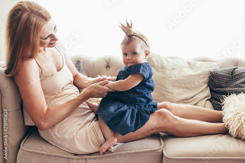 Young mom with her 8 month baby photo