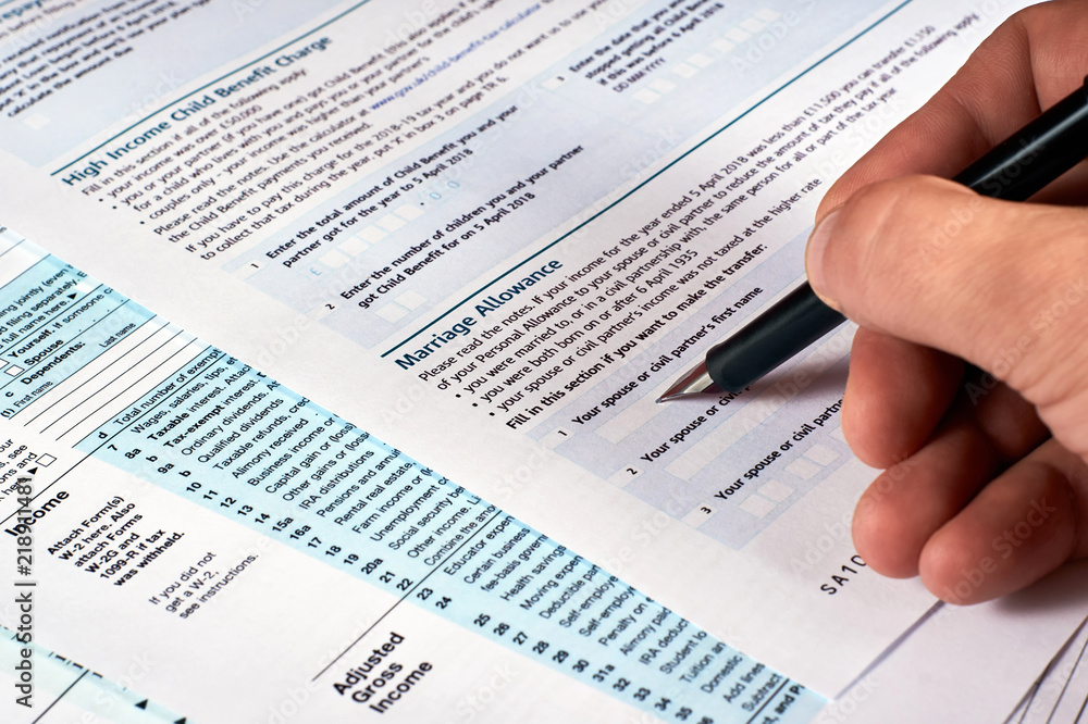 Tax reporting. Human completes the tax form Tax reporting. Human completes the tax form