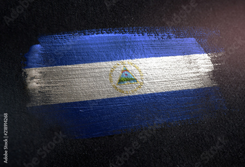 Nicaragua Flag Made of Metallic Brush Paint on Grunge Dark Wall