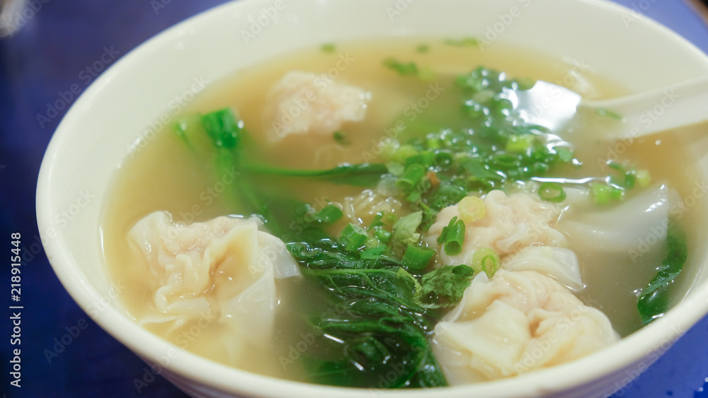 Shrimp Dumpling soup with green vegetable in the bowl Shrimp Dumpling soup with green vegetable in the bowl