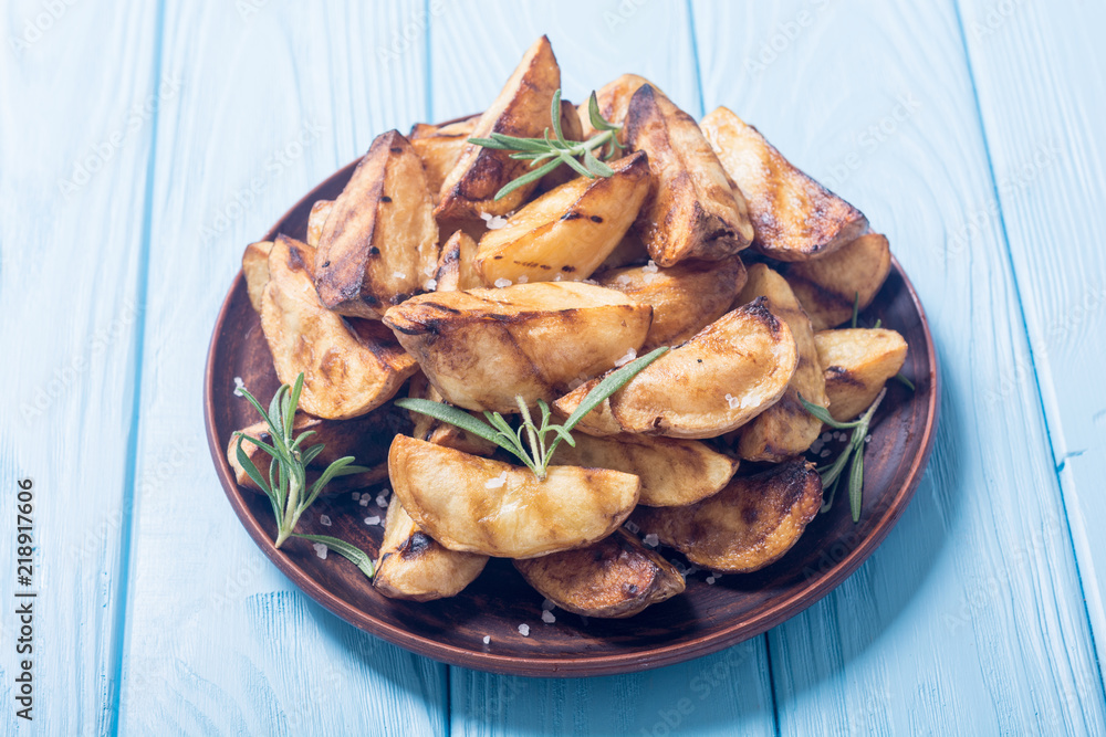 Homemade grilled potatoes with rosemary Homemade grilled potatoes with rosemary