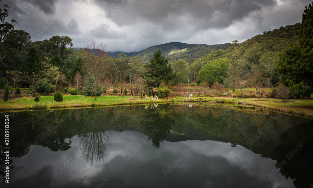 Lake waterfront countryside landscape with dramatic clouds in Australian Alps