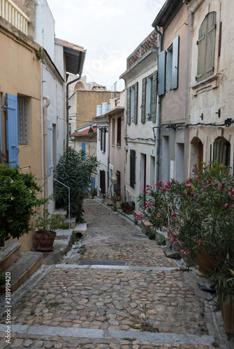Steps and narrow street in the old town of Arles in Provence in the South of France. © wjarek